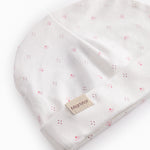 White baby hat with small flowers
