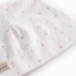 White baby hat with small flowers