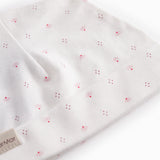 White baby hat with small flowers