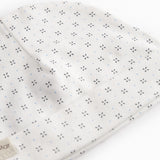 White baby hat with fine pattern