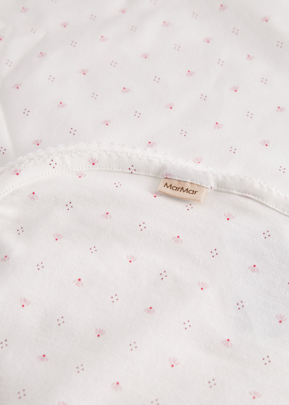 White baby blanket with small flowers