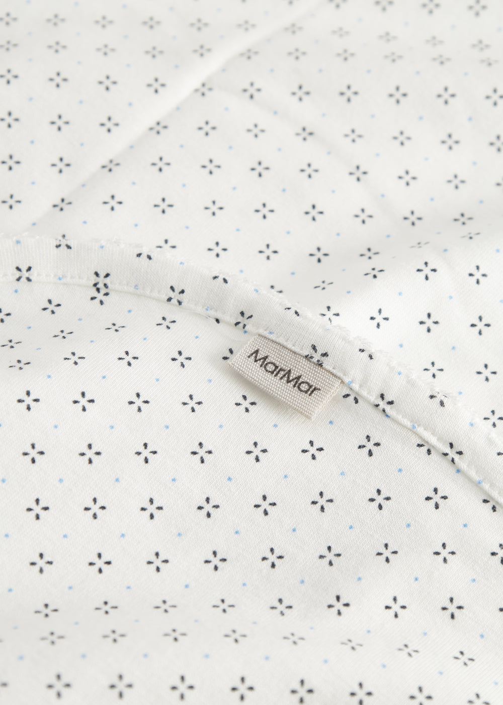 White baby blanket with fine pattern