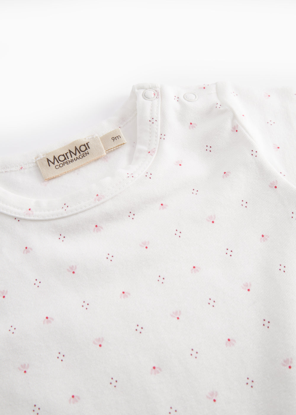 White short-sleeved baby bodysuit with small flowers