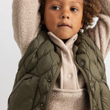 Dark green padded vest with snap closure and quilted pattern, details on the chest.