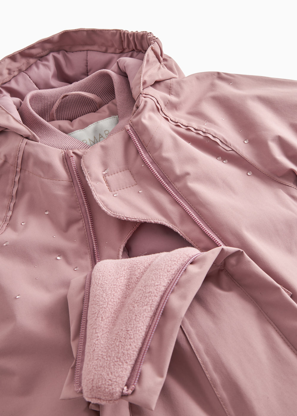 Pink flight suit with zipper and fleece/wool cuff at the wrist.