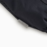 Dark flight suit pants with MARMAR label at the bottom of the leg.