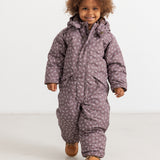 Dark brown jumpsuit with hood and zipper; small floral print.