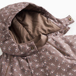 Floral patterned fleece jacket with printed button details at the collar.