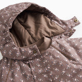 Floral patterned fleece jacket with printed button details at the collar.