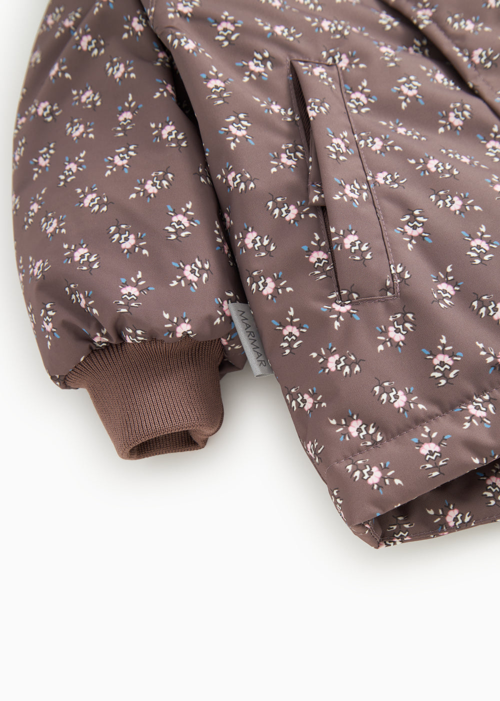 Winter jacket with hood, floral pattern and ribbed cuff.