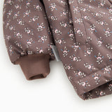 Winter jacket with hood, floral pattern and ribbed cuff.