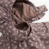 Jacket with open zipper and lined interior; small floral print in dark brown.