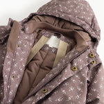 Hooded jumpsuit with zipper and small floral print in dark brown.