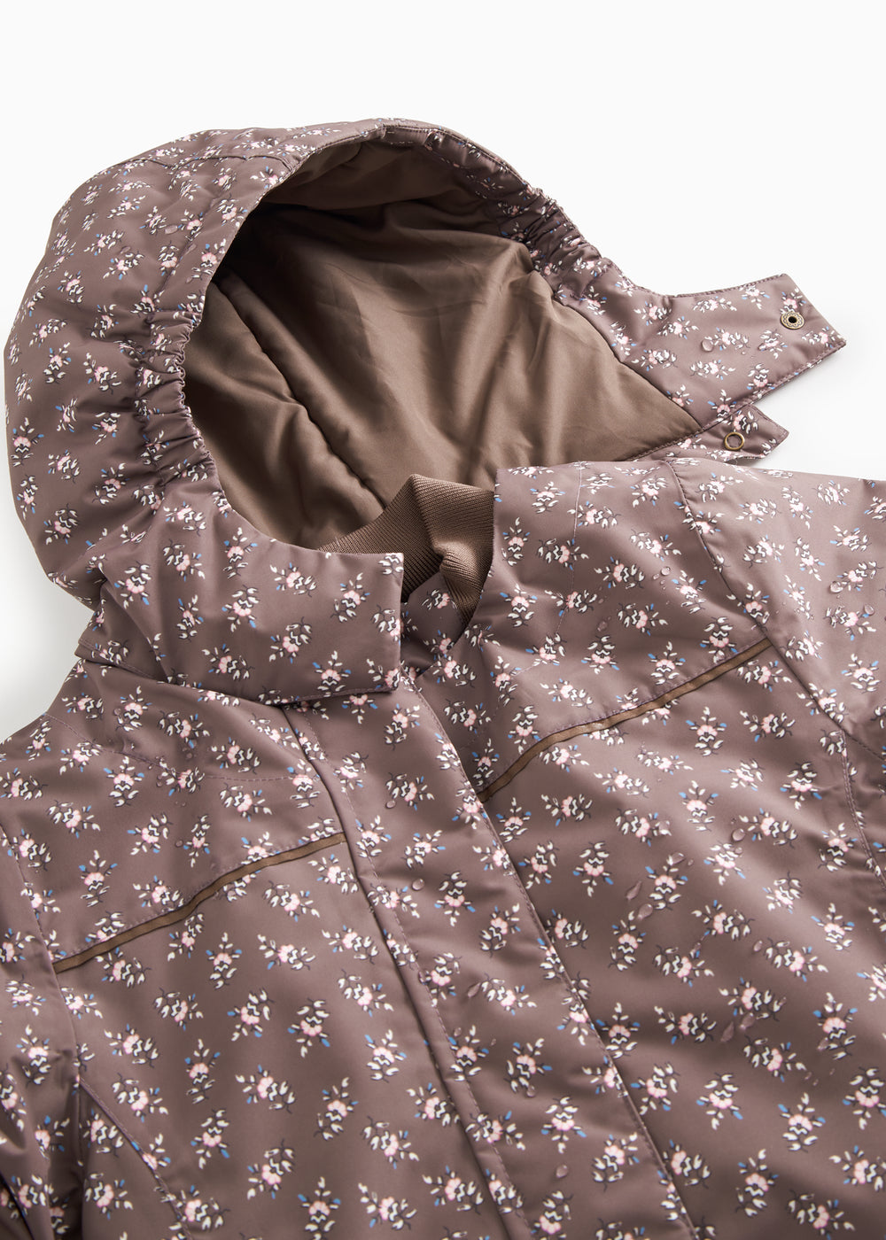 Winter jacket with hood and visible front in dark brown; floral print all over.