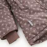 Winter jacket with hood in dark brown and small light floral print; rib cuffs