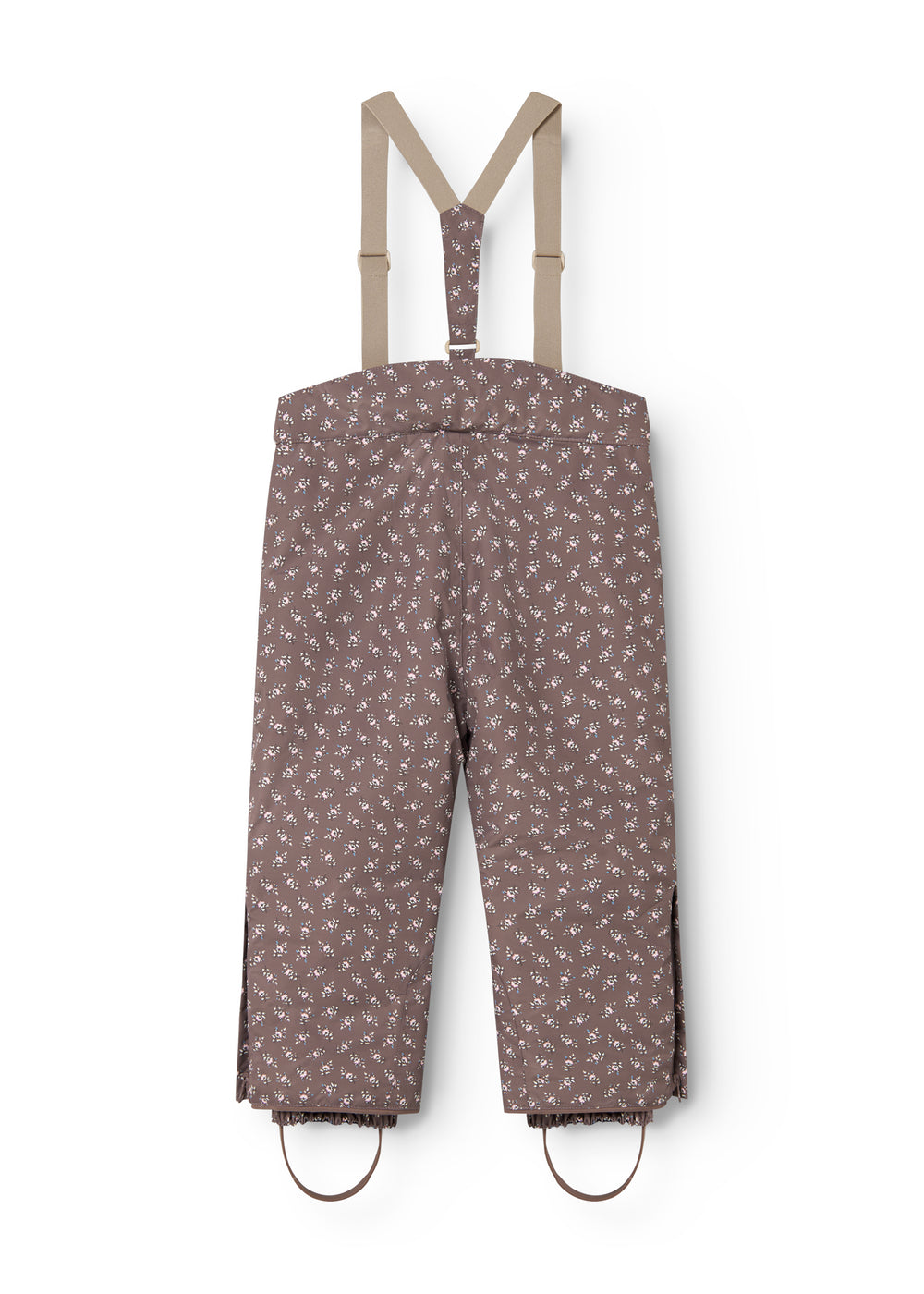Dark brown overalls with small white flowers, straps and elastic at the legs.