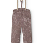 Dark brown overalls with small white flowers, adjustable straps and a central button.
