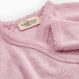 Pink bodystocking with lace pattern, ribbed collar, and visible brand label.