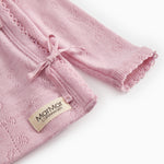 Pink blouse with long sleeves, ribbed edge and front bow.