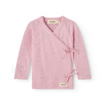 Pink cover blouse with long sleeves and cross closure in front.