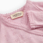 Pink baby jumpsuit with MaMaGar brand and fine perforated texture.