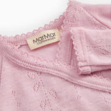 Pink baby jumpsuit with MaMaGar brand and fine perforated texture.