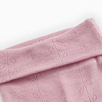 Kids' trousers in soft berry-pink with a wide ribbed edge at the top and a hollow-patterned knit.