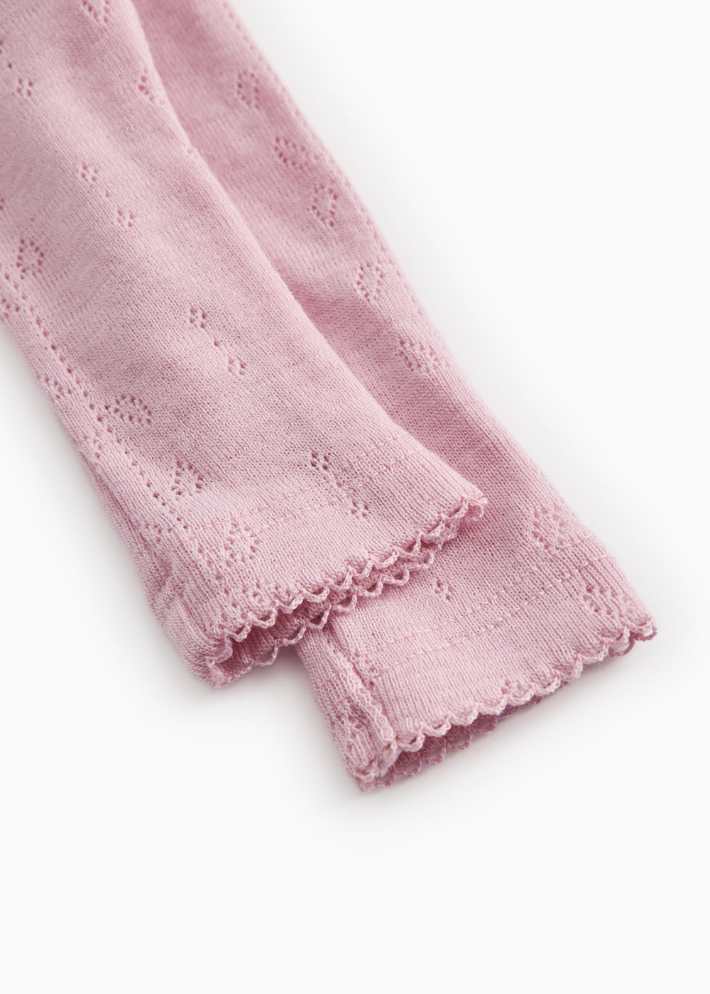 Soft berry baby pants with elastic bottom edge and floral jacquard pattern.