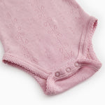 Benedikte bodystocking in pink with snap button and ribbed edge at the leg opening.