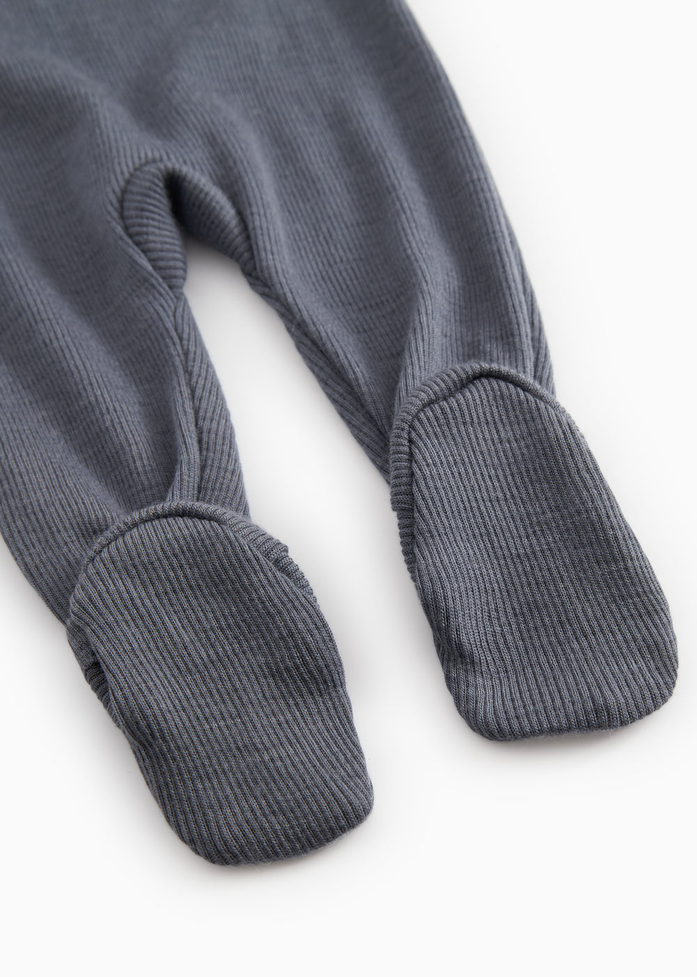 Dark gray jumpsuit with long legs and ribbed cuffs at the ankles.