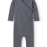 Rula held a dark gray rib dress with long sleeves and a knot band at the chest.