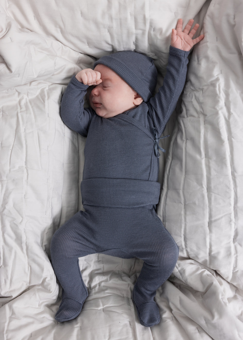 Sheer bodystocking in dark blue-gray for baby with long sleeves and legs.
