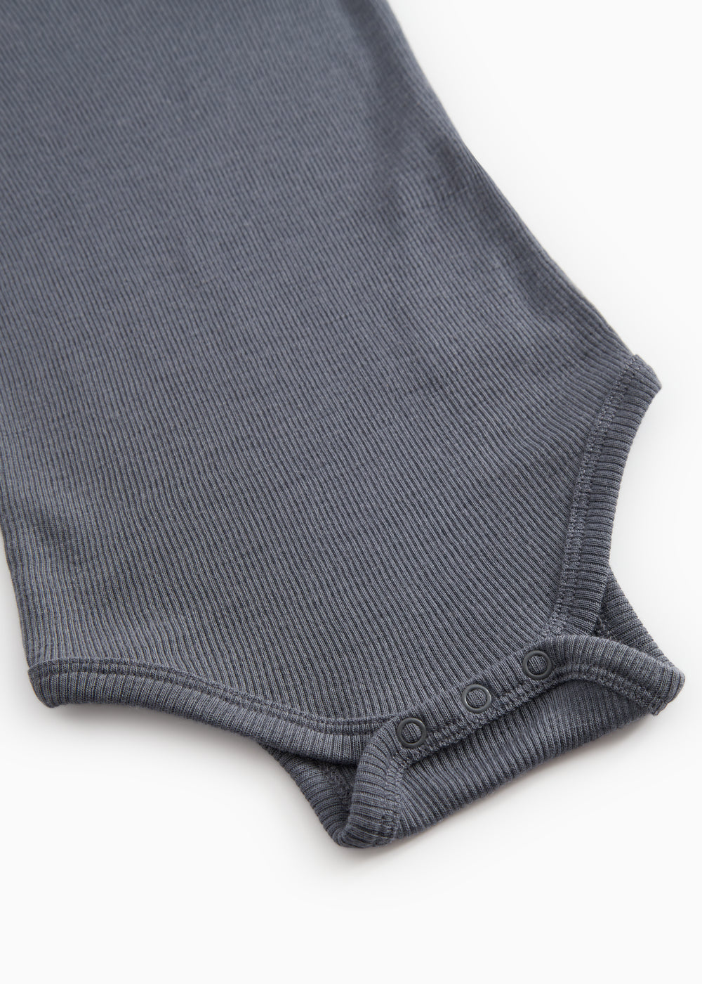 Sheer bodystocking with ribbed edge and snap buttons at the leg openings.