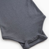 Sheer bodystocking with ribbed edge and snap buttons at the leg openings.