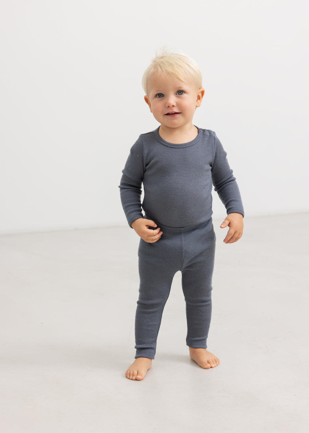 Gray leggings for a small child with long legs