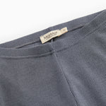 Dark gray leggings with elastic waist and visible brand label.