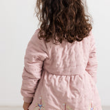 Pink down jacket with quilted front and unicorn embroidery on the back