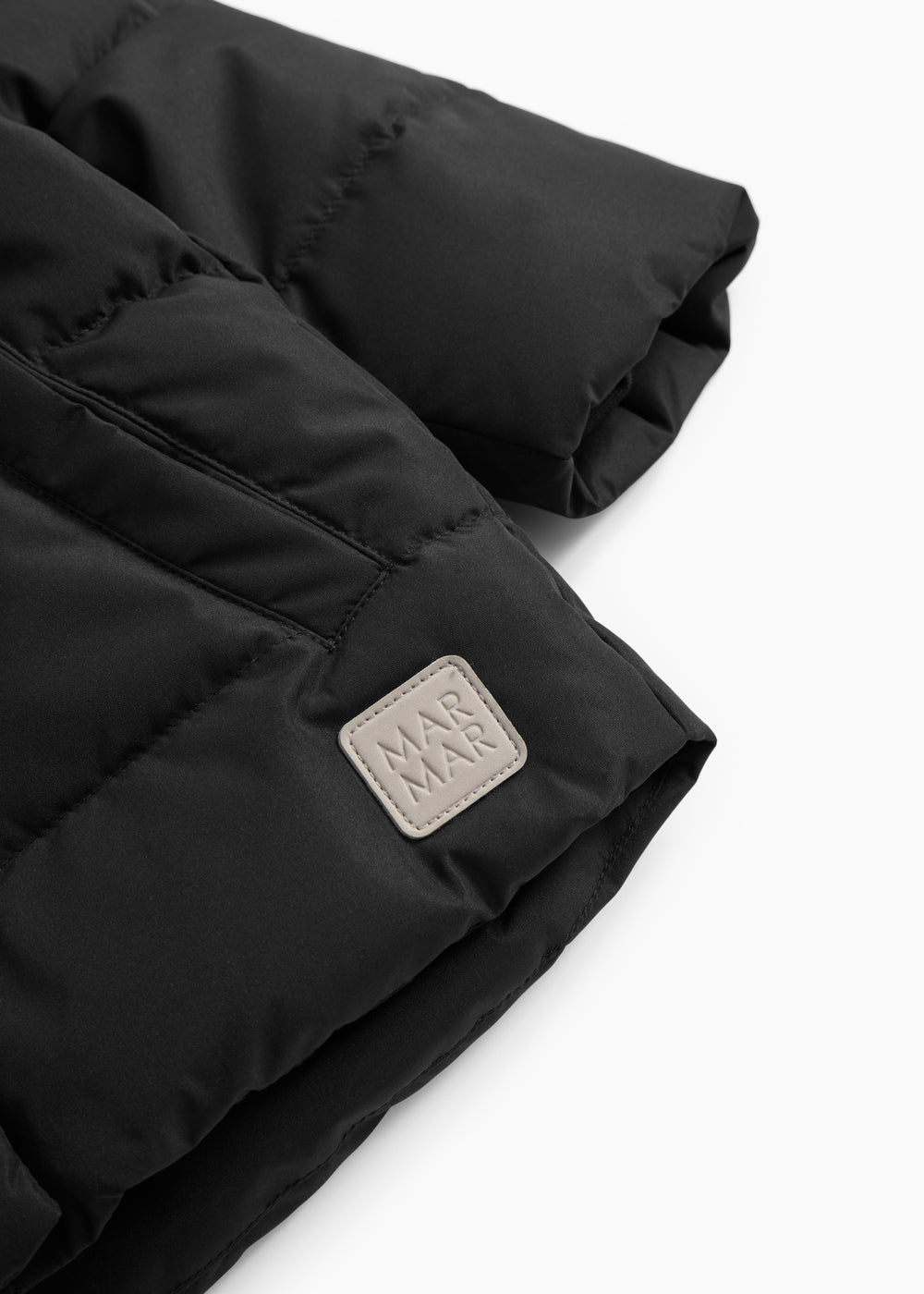 Sort jacket with hood and logo label on the sleeve.