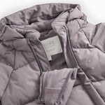 Light down jacket shell on overall with zipper and logo label.
