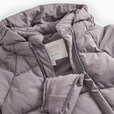 Light down jacket shell on overall with zipper and logo label.