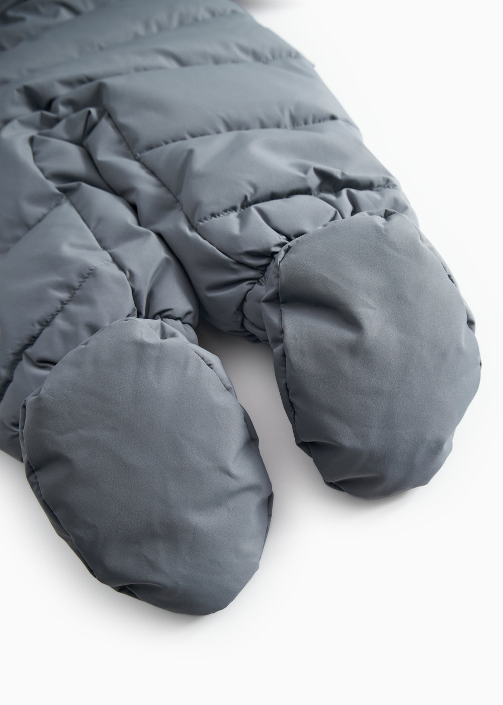 Dark gray forebody with padded legs and elastic cuffs at the feet.