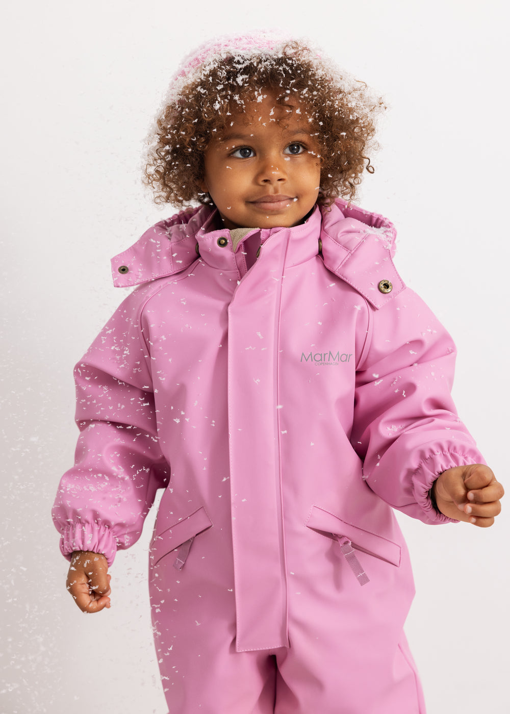 Pink PU flight suit with hood and front button details.