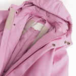 Pink PU jumpsuit with hood, zipper, and beige lining.
