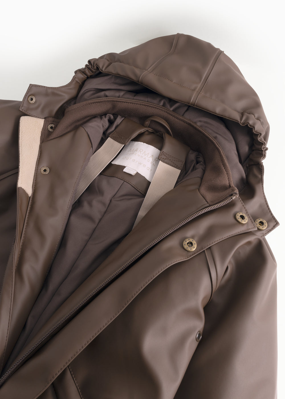A dark brown flight jacket with a diagonal zipper opening and buttons at the collar.