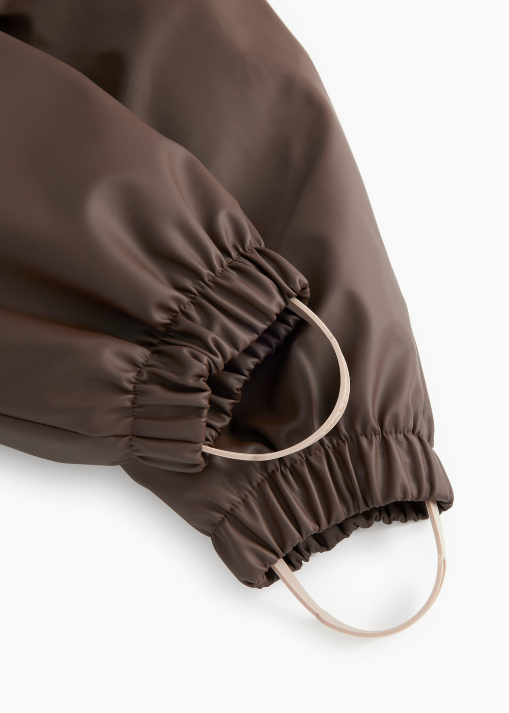PU jumpsuit dark brown: elastic finish and adjustable leg strap.