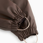 PU jumpsuit dark brown: elastic finish and adjustable leg strap.