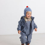 Light blue striped hat with red pom-pom and wide ribbed edge
