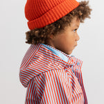 Orange striped hat with yellow pom-pom
