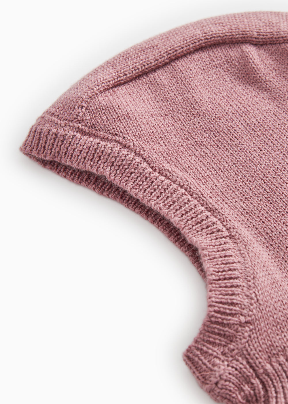 Details of the rose‑brown striped sweater: ribbed and solid color knit.