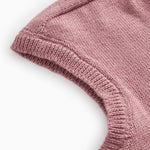 Details of the rose‑brown striped sweater: ribbed and solid color knit.
